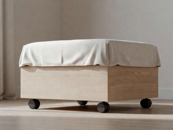Soft-lit 3D render of a low-profile ash under-bed crate with recessed rubber castors and a linen dust cover
